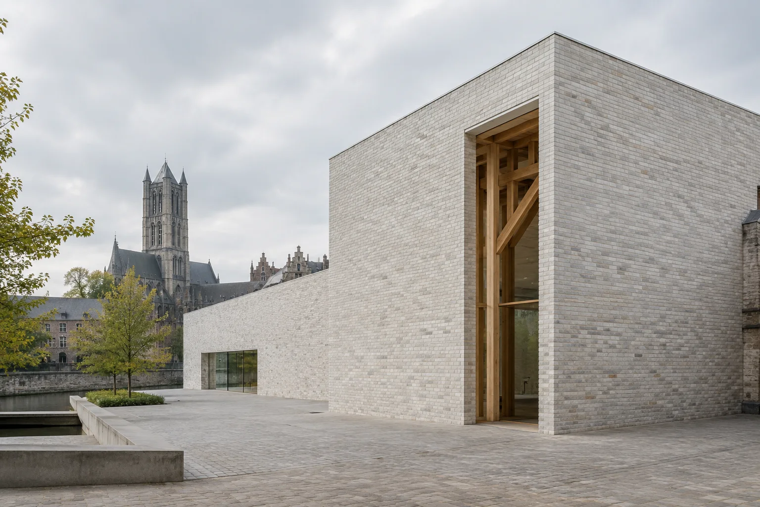 Extension géométrique du musée à Gand, revêtue de briques blanches, avec une entrée dégagée